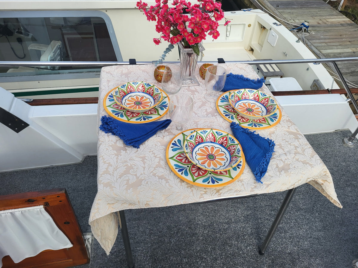 Dinner for three on the back deck of a boat, served on The Big John Table clamped to the rail