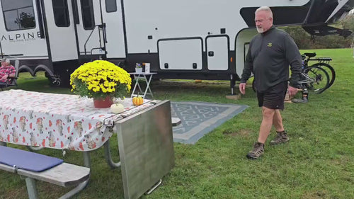 Video: setting up The Big John Table at an RV campsite, flipping it up from the picnic table and dropping the adjustable legs